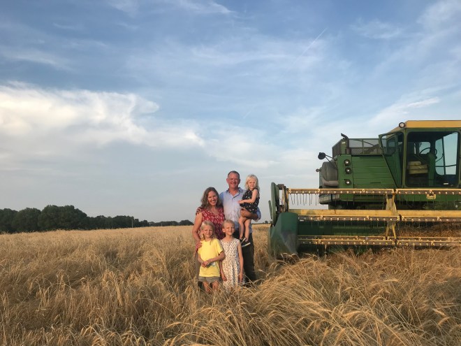 Penner Versluis Family in Organic Turkey Red Winter Wheat